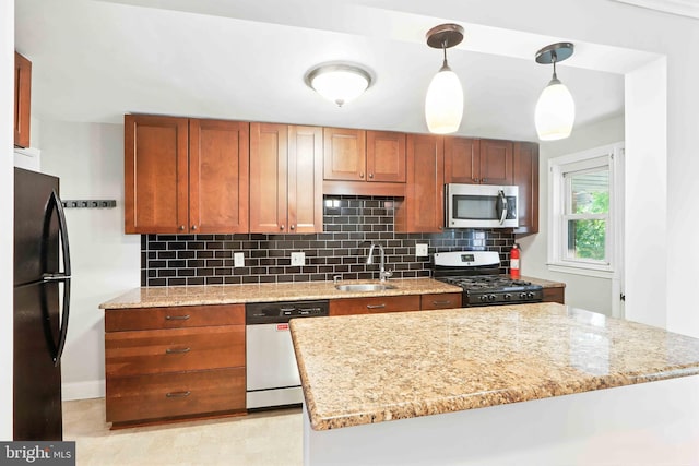 3714 Greenvale Rd, Baltimore, MD 21229 - kitchen with appliances with stainless steel finishes, decorative backsplash, and light stone countertops