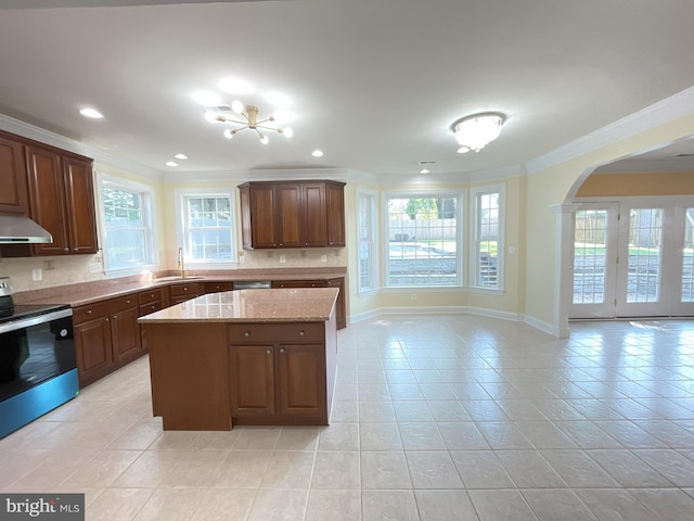 7212 Highland St, Springfield, VA 22150 - kitchen featuring appliances with stainless steel finishes, ventilation hood, ornamental molding, light tile patterned floors, and decorative backsplash
