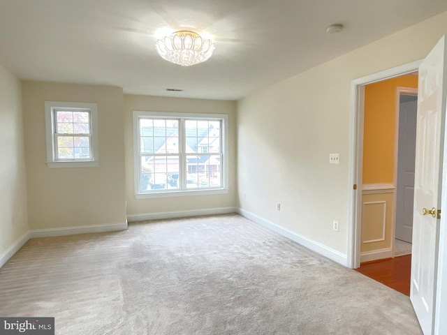 7212 Highland St, Springfield, VA 22150 - unfurnished room with a smoke detector, carpet floors, and a chandelier