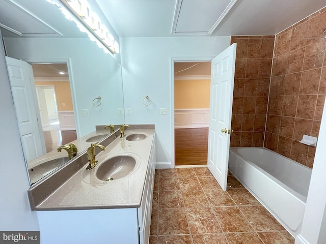 7212 Highland St, Springfield, VA 22150 - bathroom featuring double vanity, a decorative wall, bathing tub / shower combination, and a wainscoted wall