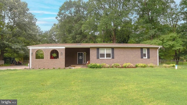 4015 Clyde Ln, White Plains, MD 20695 - ranch-style home featuring view of wooded area and brick siding