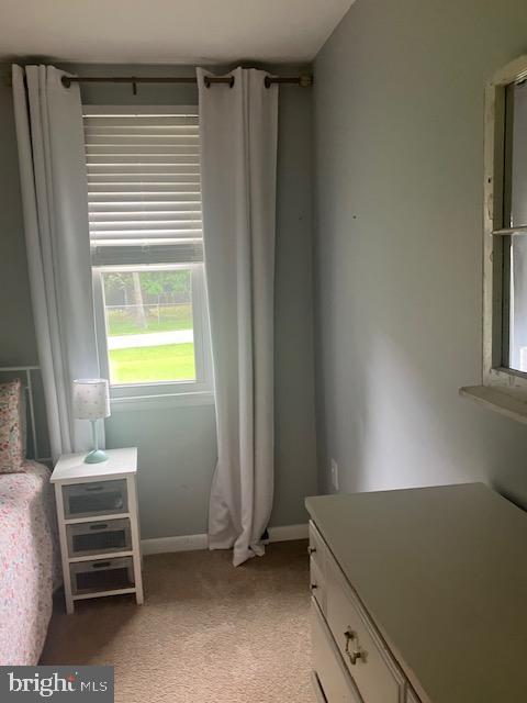 4015 Clyde Ln, White Plains, MD 20695 - bedroom featuring light colored carpet and baseboards