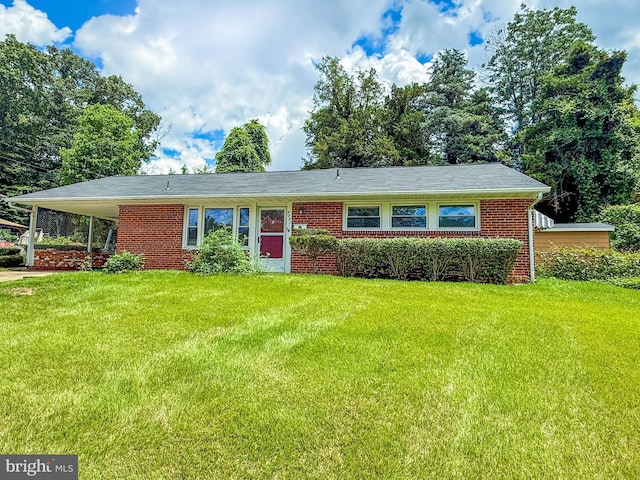 5307 Juxon Pl, Springfield, VA 22151 - view of front of house with a front yard, an attached carport, and brick siding