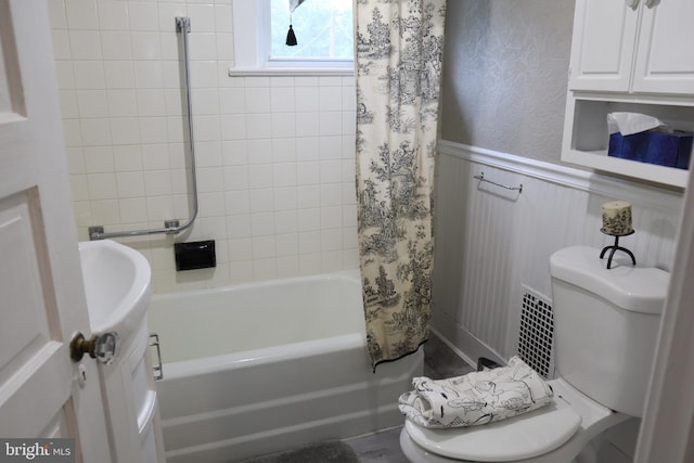 814 Morgan Ave, Palmyra, NJ 08065 - bathroom featuring shower / bath combination with curtain, a wainscoted wall, and vanity