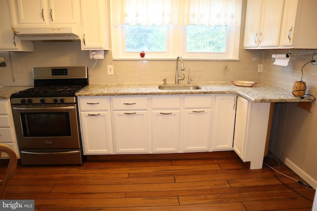 814 Morgan Ave, Palmyra, NJ 08065 - kitchen featuring stainless steel gas range, under cabinet range hood, white cabinets, dark wood-style flooring, and decorative backsplash