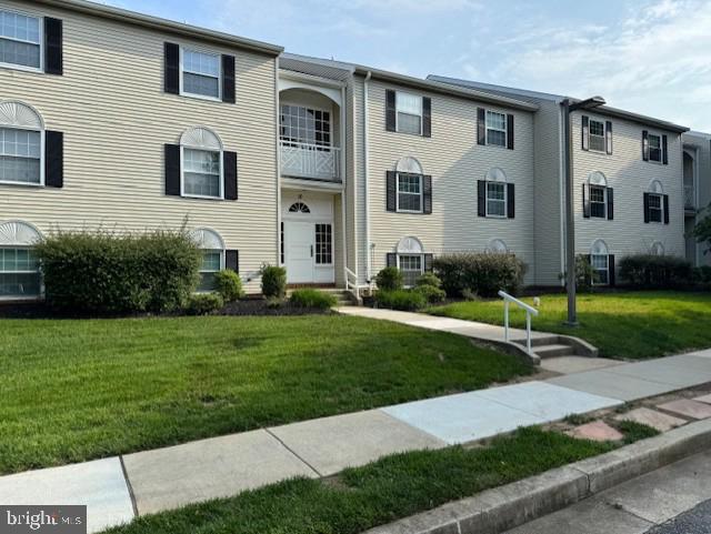 10 Brooking Ct Unit 102, Lutherville Timonium, MD 21093 - view of front facade featuring a front yard