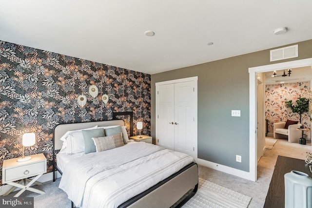 539 Whimsical Dr, Havre De Grace, MD 21078 - bedroom with light colored carpet, a closet, and wallpapered walls