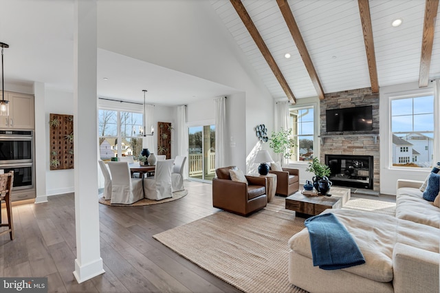 539 Whimsical Dr, Havre De Grace, MD 21078 - living area with healthy amount of natural light, hardwood / wood-style floors, a fireplace, high vaulted ceiling, and a wood ceiling with exposed beams