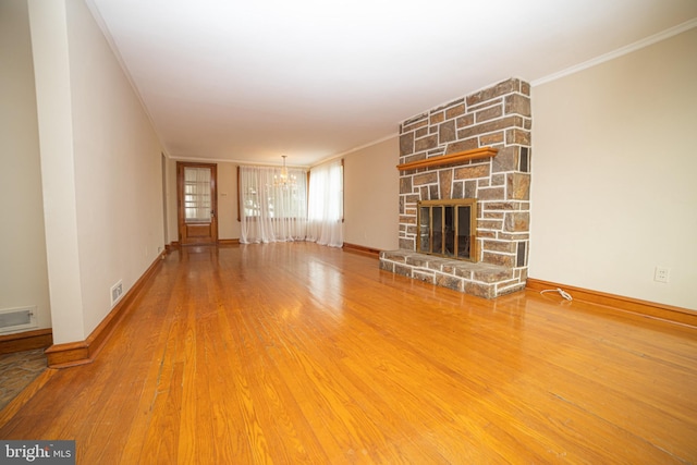 4117 Chichester Ave, Upper Chichester, PA 19061 - unfurnished living room with ornamental molding, a chandelier, wood finished floors, and a fireplace