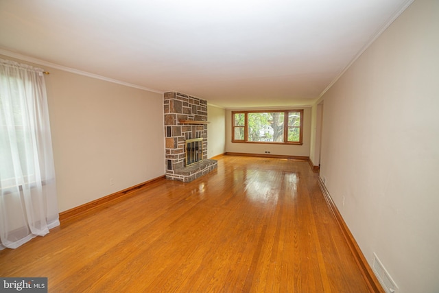 4117 Chichester Ave, Upper Chichester, PA 19061 - unfurnished living room with a fireplace, wood finished floors, and crown molding