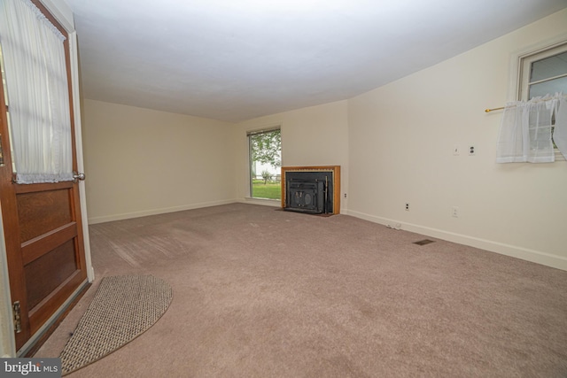 4117 Chichester Ave, Upper Chichester, PA 19061 - unfurnished living room featuring carpet and a fireplace with flush hearth