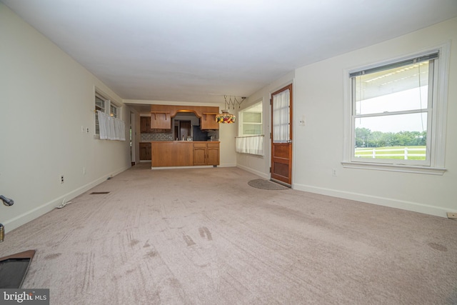 4117 Chichester Ave, Upper Chichester, PA 19061 - unfurnished living room with light colored carpet and arched walkways
