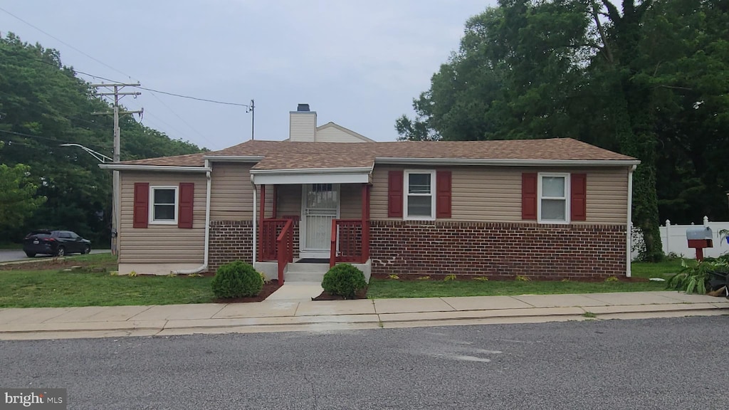 13137 12th St, Bowie, MD 20715 - bungalow-style house featuring a chimney and brick siding