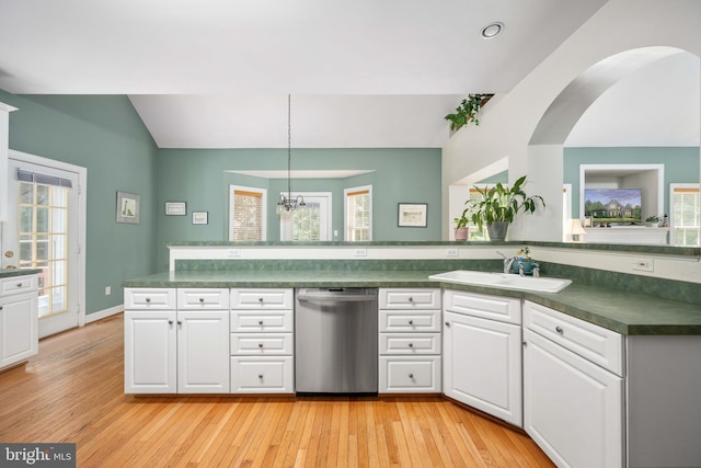 4 Monument Dr, Stafford, VA 22554 - kitchen featuring dishwasher, dark countertops, healthy amount of natural light, vaulted ceiling, and white cabinetry