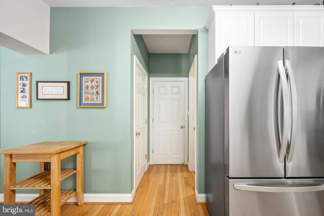 4 Monument Dr, Stafford, VA 22554 - kitchen featuring freestanding refrigerator, light wood-type flooring, and white cabinetry