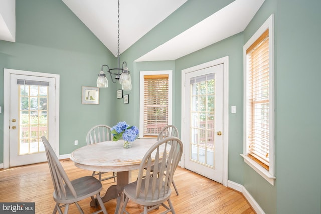 4 Monument Dr, Stafford, VA 22554 - dining area with light wood-style floors, lofted ceiling, and a chandelier