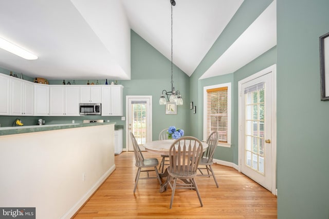 4 Monument Dr, Stafford, VA 22554 - dining space featuring light wood finished floors, lofted ceiling, and a chandelier