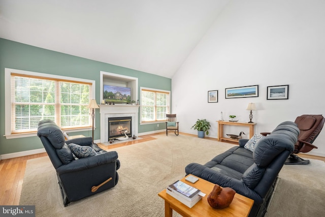 4 Monument Dr, Stafford, VA 22554 - living room featuring high vaulted ceiling, a fireplace with flush hearth, and wood finished floors