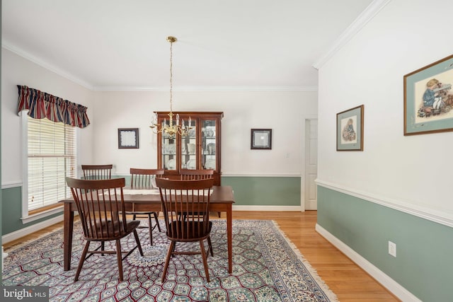 4 Monument Dr, Stafford, VA 22554 - dining area with ornamental molding, light wood-type flooring, and a chandelier