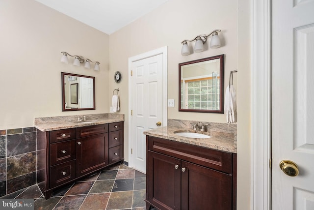 4 Monument Dr, Stafford, VA 22554 - bathroom featuring two vanities and stone finish flooring