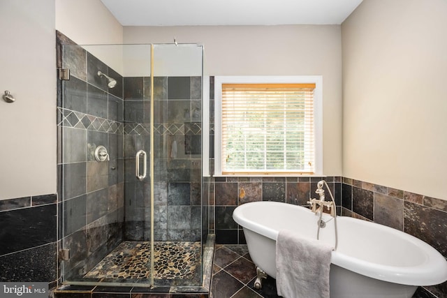 4 Monument Dr, Stafford, VA 22554 - full bath featuring tile walls, a stall shower, a freestanding bath, and a wainscoted wall