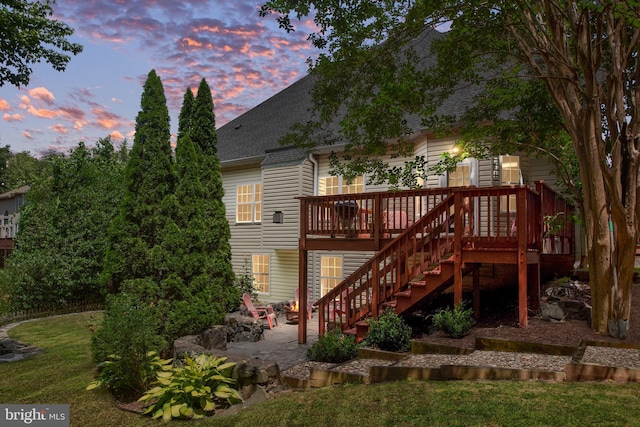 4 Monument Dr, Stafford, VA 22554 - back of property featuring roof with shingles, a wooden deck, a patio, and stairs