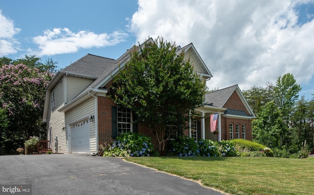 4 Monument Dr, Stafford, VA 22554 - view of front of property with brick siding, a front lawn, a garage, and driveway