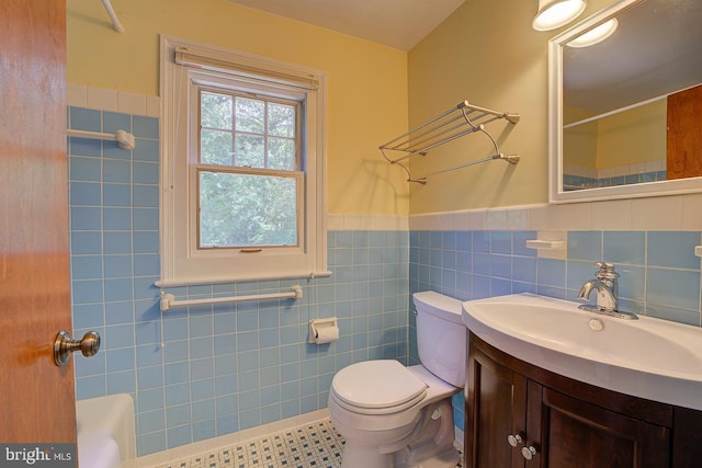 6717 44th Ave, Hyattsville, MD 20782 - full bathroom featuring tile walls, vanity, a wainscoted wall, and tile patterned floors