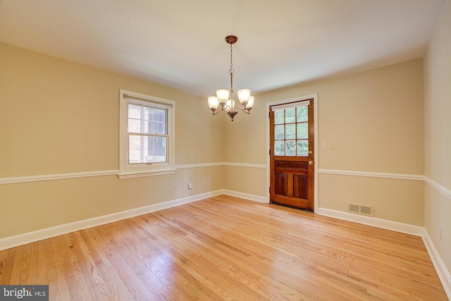 6717 44th Ave, Hyattsville, MD 20782 - spare room featuring a chandelier and light wood-style floors