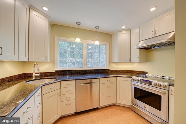 6717 44th Ave, Hyattsville, MD 20782 - kitchen featuring appliances with stainless steel finishes, under cabinet range hood, pendant lighting, white cabinets, and recessed lighting