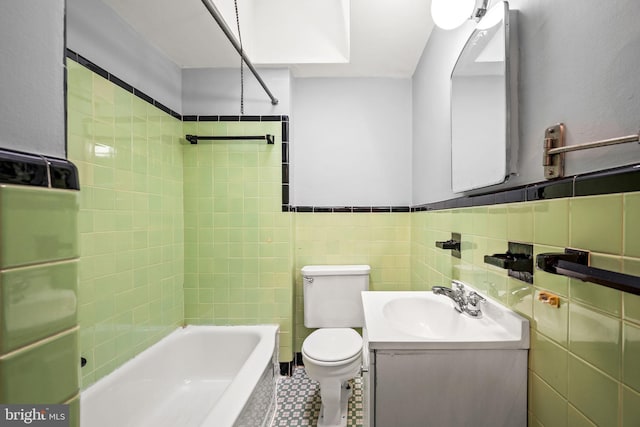 643 Beech Ave, Glenolden, PA 19036 - bathroom featuring vanity, shower / washtub combination, and tile walls
