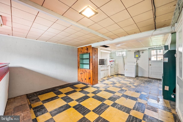 643 Beech Ave, Glenolden, PA 19036 - below grade area with washer / dryer, tile patterned floors, and a paneled ceiling
