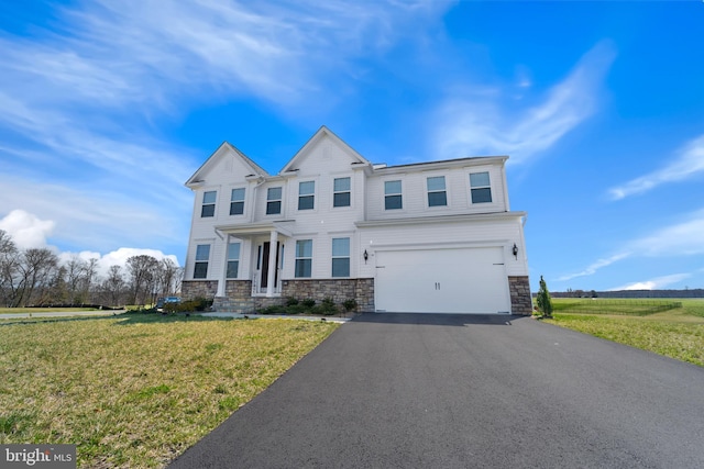 10137 Premier St, Fredericksburg, VA 22408 - view of front facade featuring stone siding, a garage, driveway, and a front lawn