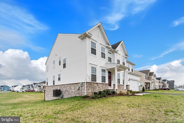 10137 Premier St, Fredericksburg, VA 22408 - view of front facade with stone siding, a front lawn, and a residential view