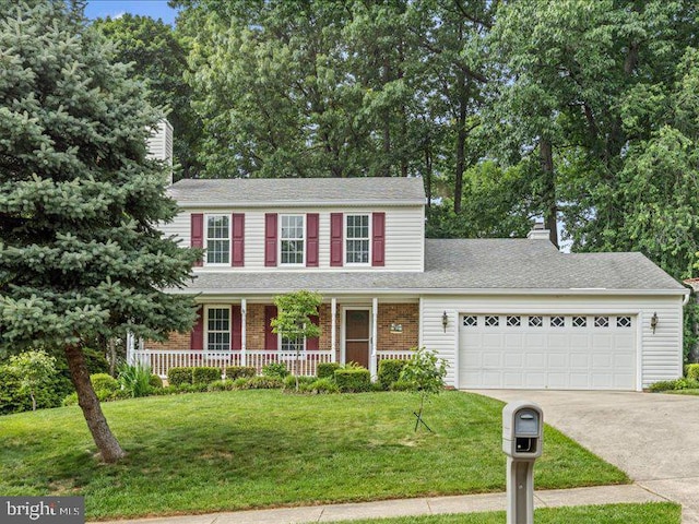 900 Young Dairy Ct, Herndon, VA 20170 - view of front of property featuring a chimney, an attached garage, driveway, and a front lawn