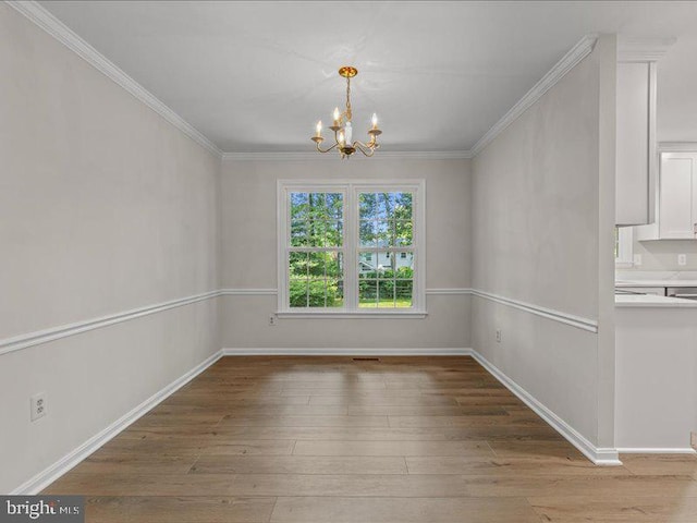 900 Young Dairy Ct, Herndon, VA 20170 - unfurnished dining area with a chandelier, hardwood / wood-style flooring, and ornamental molding