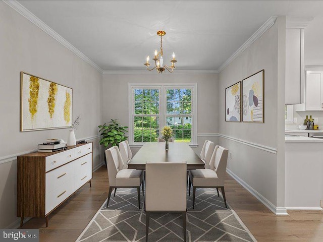 900 Young Dairy Ct, Herndon, VA 20170 - dining space with dark wood finished floors, a chandelier, and ornamental molding