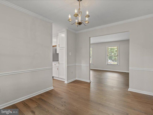 900 Young Dairy Ct, Herndon, VA 20170 - empty room with ornamental molding, a chandelier, and wood finished floors