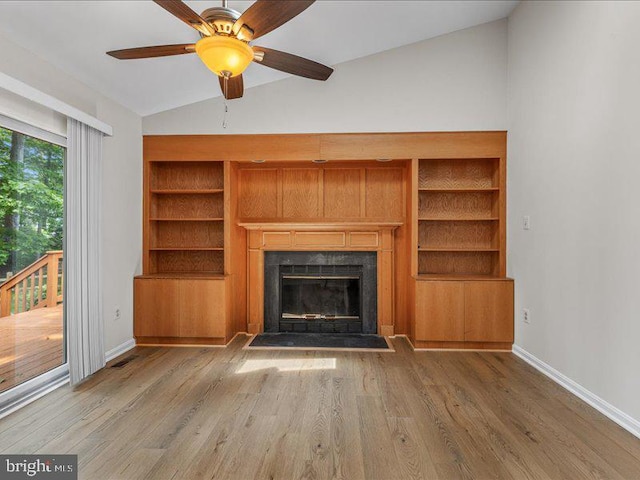 900 Young Dairy Ct, Herndon, VA 20170 - unfurnished living room featuring lofted ceiling, wood finished floors, a fireplace, and a ceiling fan