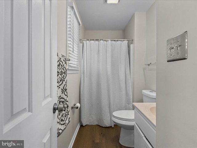 900 Young Dairy Ct, Herndon, VA 20170 - full bathroom featuring wood finished floors, vanity, and a shower with shower curtain