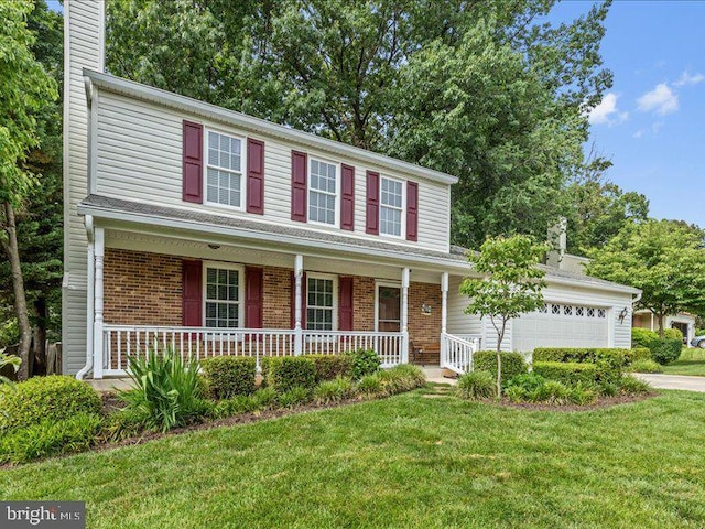 900 Young Dairy Ct, Herndon, VA 20170 - view of front of home featuring an attached garage, driveway, a porch, brick siding, and a chimney