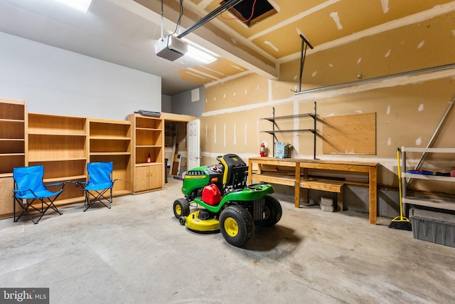 135 Hobbs Hole Ln, Tappahannock, VA 22560 - garage with a garage door opener and a workshop area