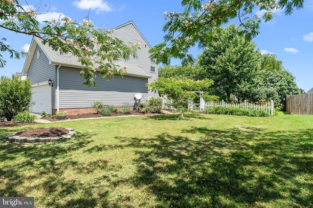 135 Hobbs Hole Ln, Tappahannock, VA 22560 - view of yard featuring a garage