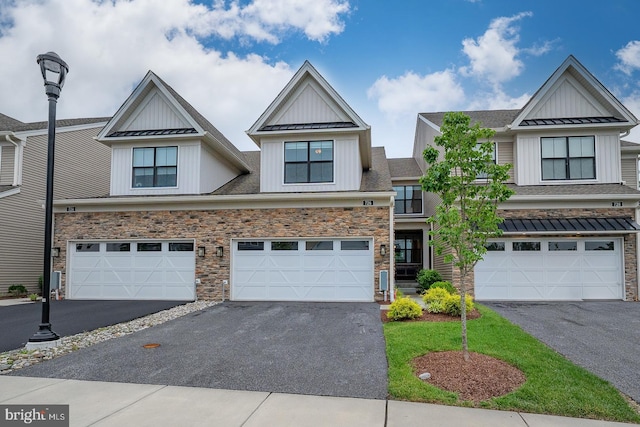 726 Switchman Rd, Media, PA 19063 - view of front of property featuring board and batten siding, driveway, a standing seam roof, a metal roof, and an attached garage