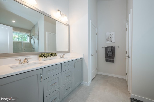 726 Switchman Rd, Media, PA 19063 - bathroom featuring double vanity, tiled shower, and tile patterned flooring