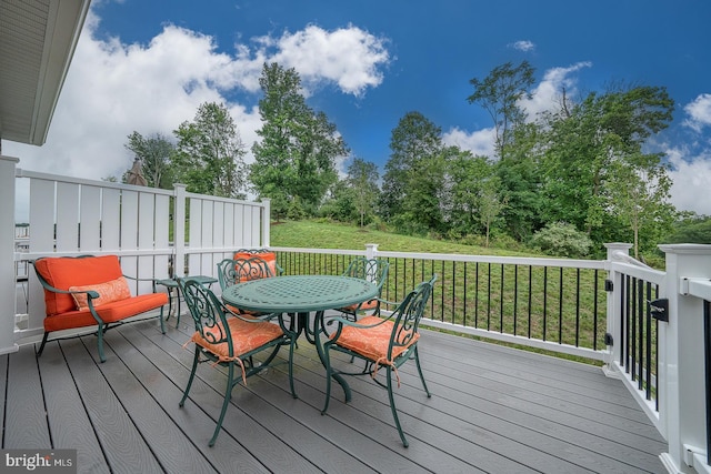 726 Switchman Rd, Media, PA 19063 - wooden terrace with outdoor dining space and a lawn