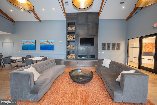 726 Switchman Rd, Media, PA 19063 - living area with beam ceiling, wood finished floors, and a towering ceiling