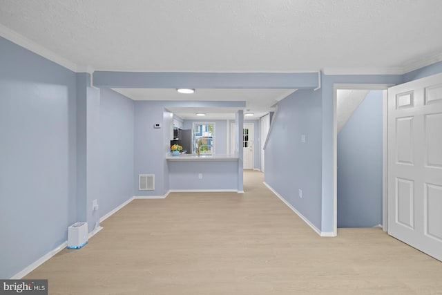 8318 Brookvale Ct, Springfield, VA 22153 - unfurnished living room with light wood-style flooring, ornamental molding, and a textured ceiling