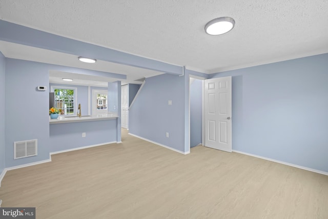 8318 Brookvale Ct, Springfield, VA 22153 - unfurnished living room with a textured ceiling and wood finished floors