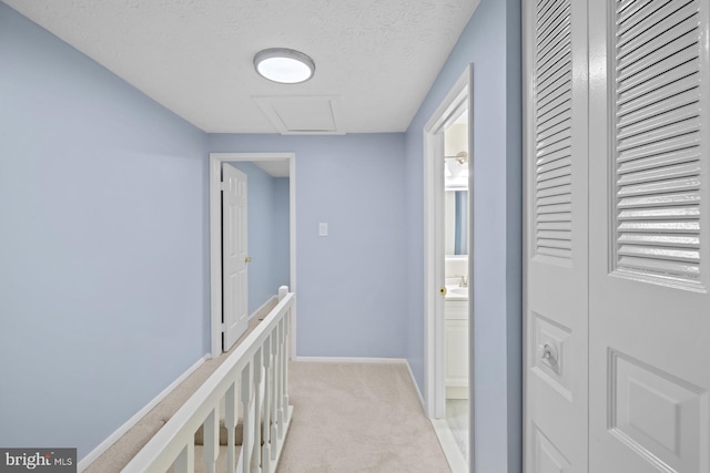 8318 Brookvale Ct, Springfield, VA 22153 - hall with attic access, light colored carpet, and a textured ceiling